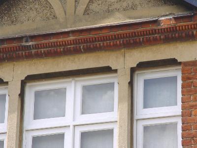 unpainted stucco window lintels